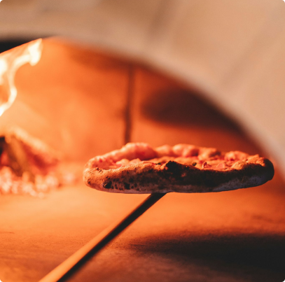 Pizza Cooked in Wood Fire Oven