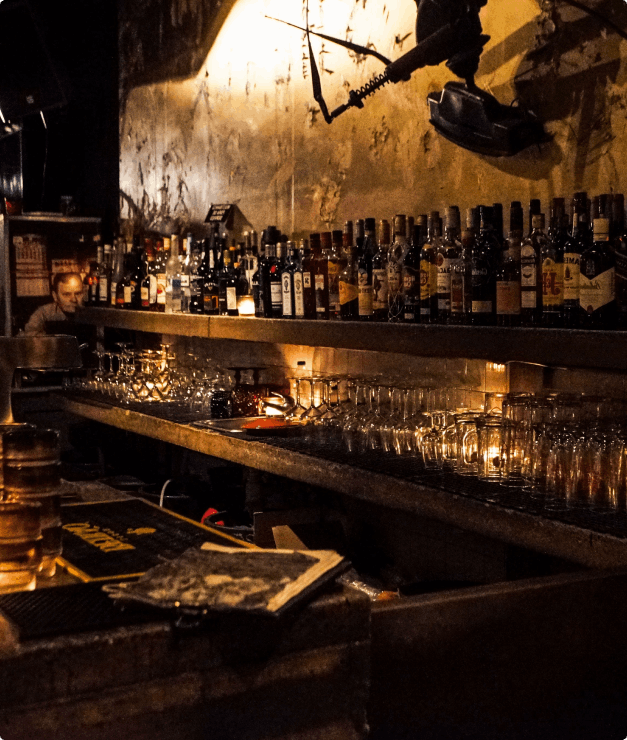 Antique Wine Scene: Assortment of Wines and Glasses Displayed Elegantly