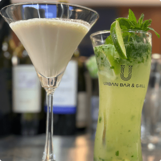 Refreshing beverages at Urban Bar & Grill: A creamy milkshake and zesty mojito with lemon